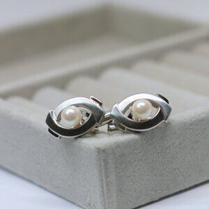 Elegant Akoya Pearl cufflinks with a unique eye design